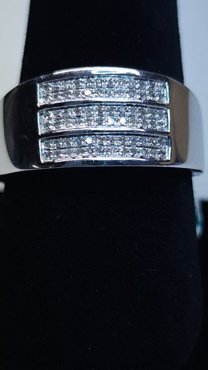 This triple row of 0.20 ctw all Natural Diamonds on a 10k white gold (WG) band is sized for a 10.5 ring finger. This bulky piece is professional and bold at the same time and perfect for daily wear or special nights out.