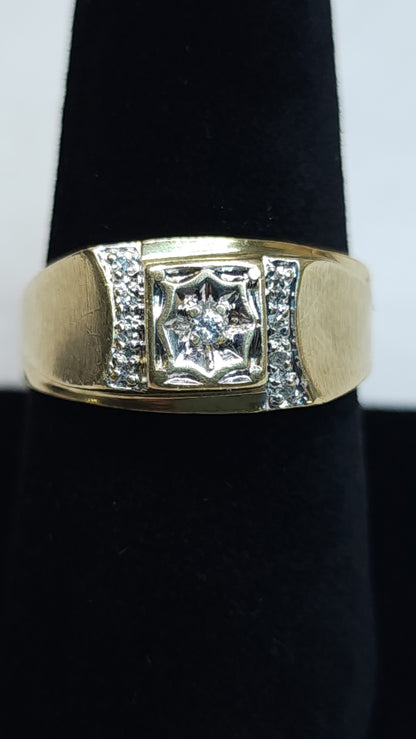 This bold 10k ring is mounted with small micro diamonds to help the peak of the design to shine. The center stone is showcased in an impressive illusion set to give it a big stone look. This piece has some signs of wear. Price is reflective