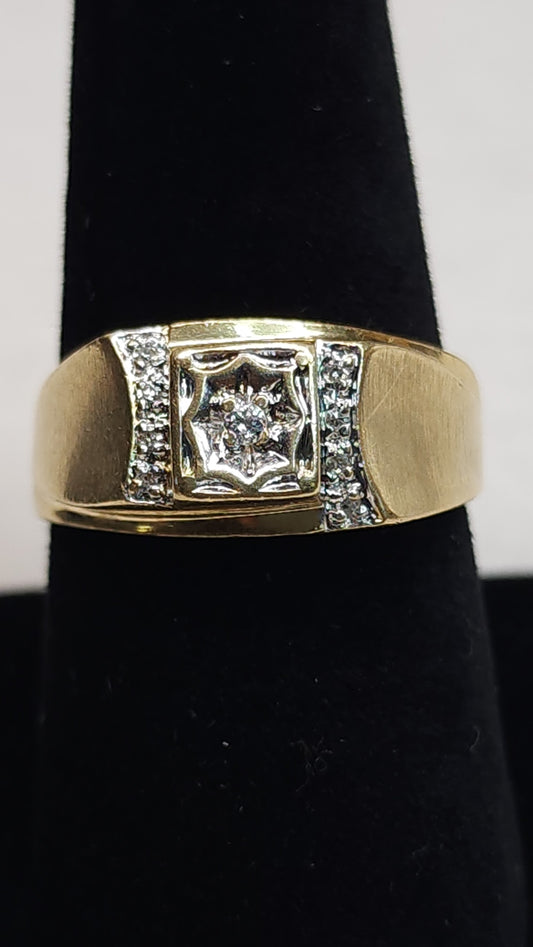 This bold 10k ring is mounted with small micro diamonds to help the peak of the design to shine. The center stone is showcased in an impressive illusion set to give it a big stone look. This piece has some signs of wear. Price is reflective